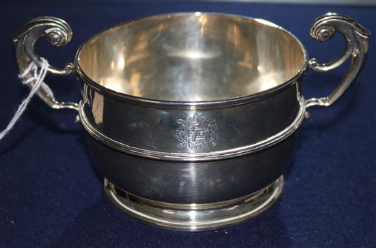 A two handled silver sugar bowl and a sauceboat and jug